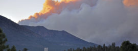 Smoke from the Schultz Fire rises as the sun sets for the day. Taken 6/20/10 by Brady Smith. Credit: USDA Forest Service, Coconino National Forest.