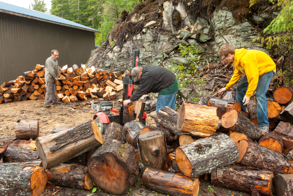 Students earn money by splitting and stacking wood to heat the schools. Across Prince of Wales the switch to wood heat has created six part-time jobs. Photo: Dan Bihn